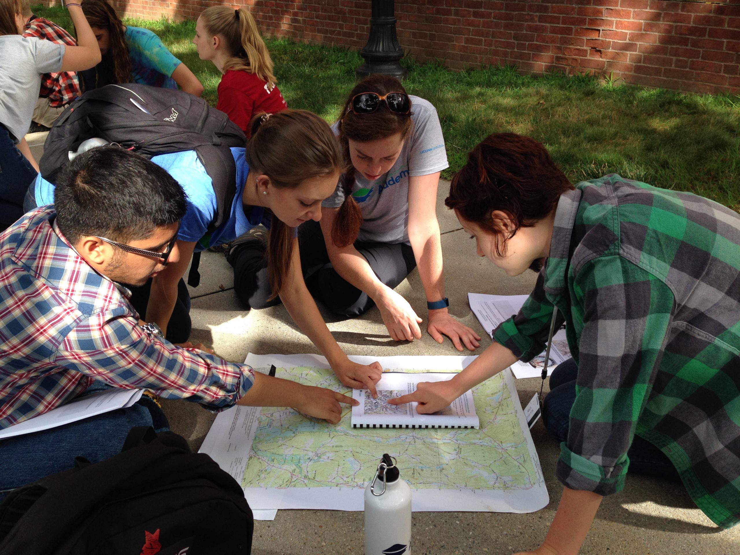 students around a map